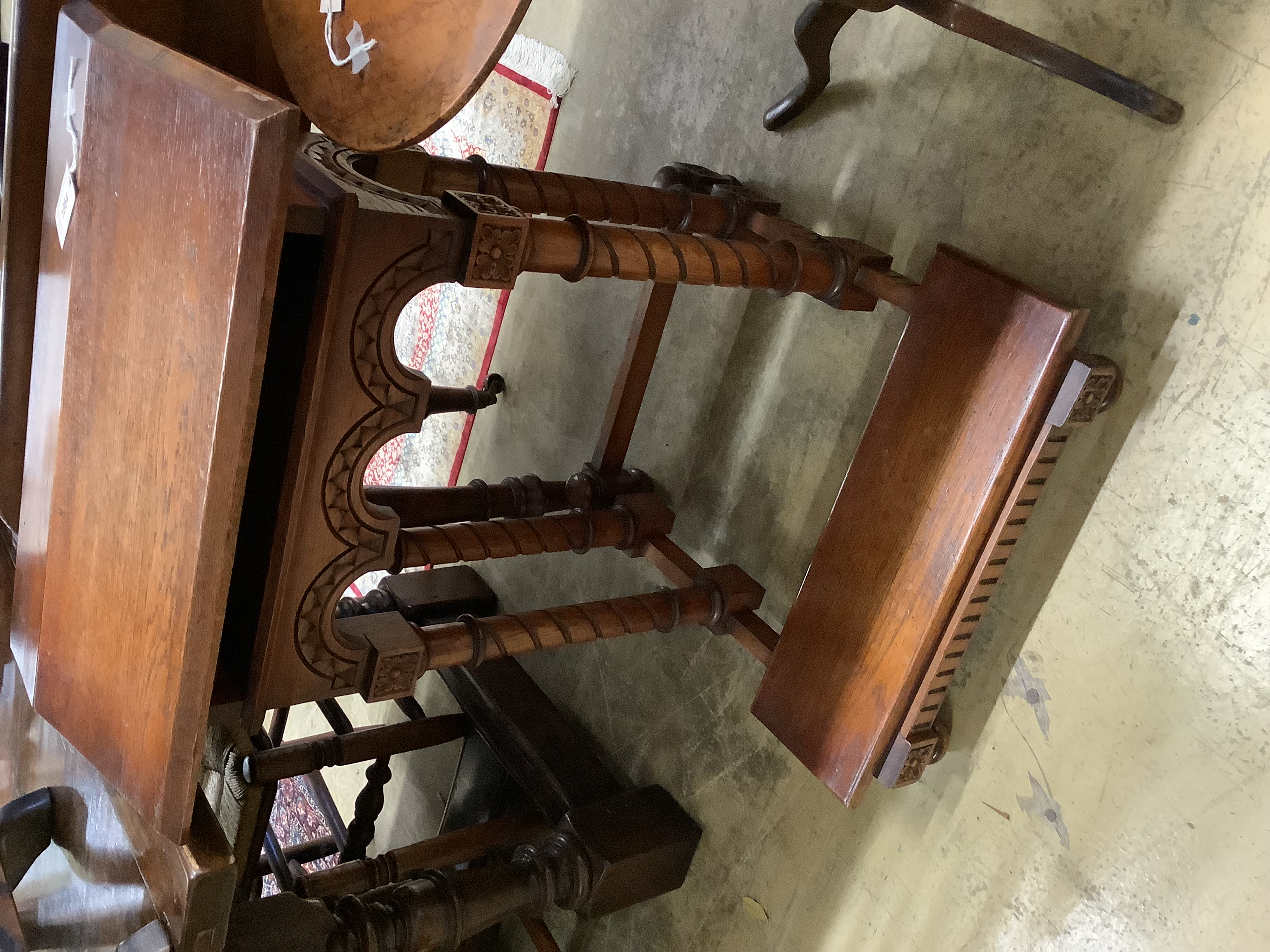 A Gothic style carved oak prie-dieu, width 64cm, height 82cm together with a 19th century circular mahogany tripod table, diameter 47cm